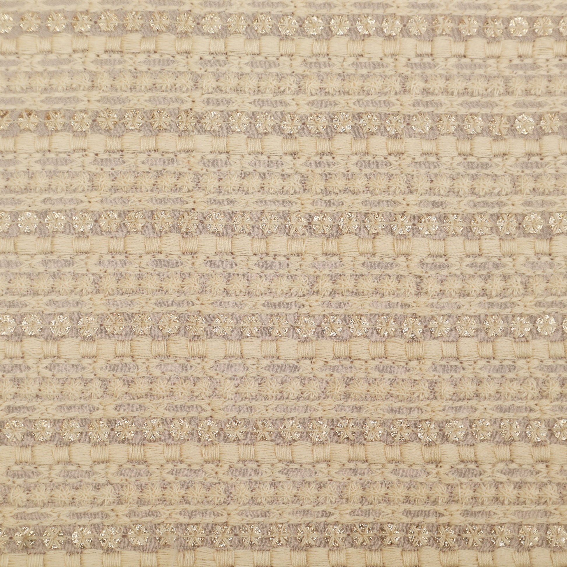 Textured fabric pattern with a subtle floral design on a beige background