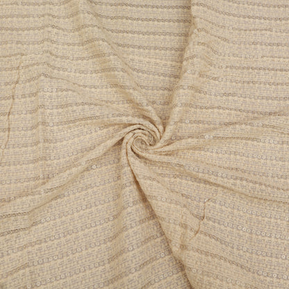 Close-up of beige fabric with subtle pattern