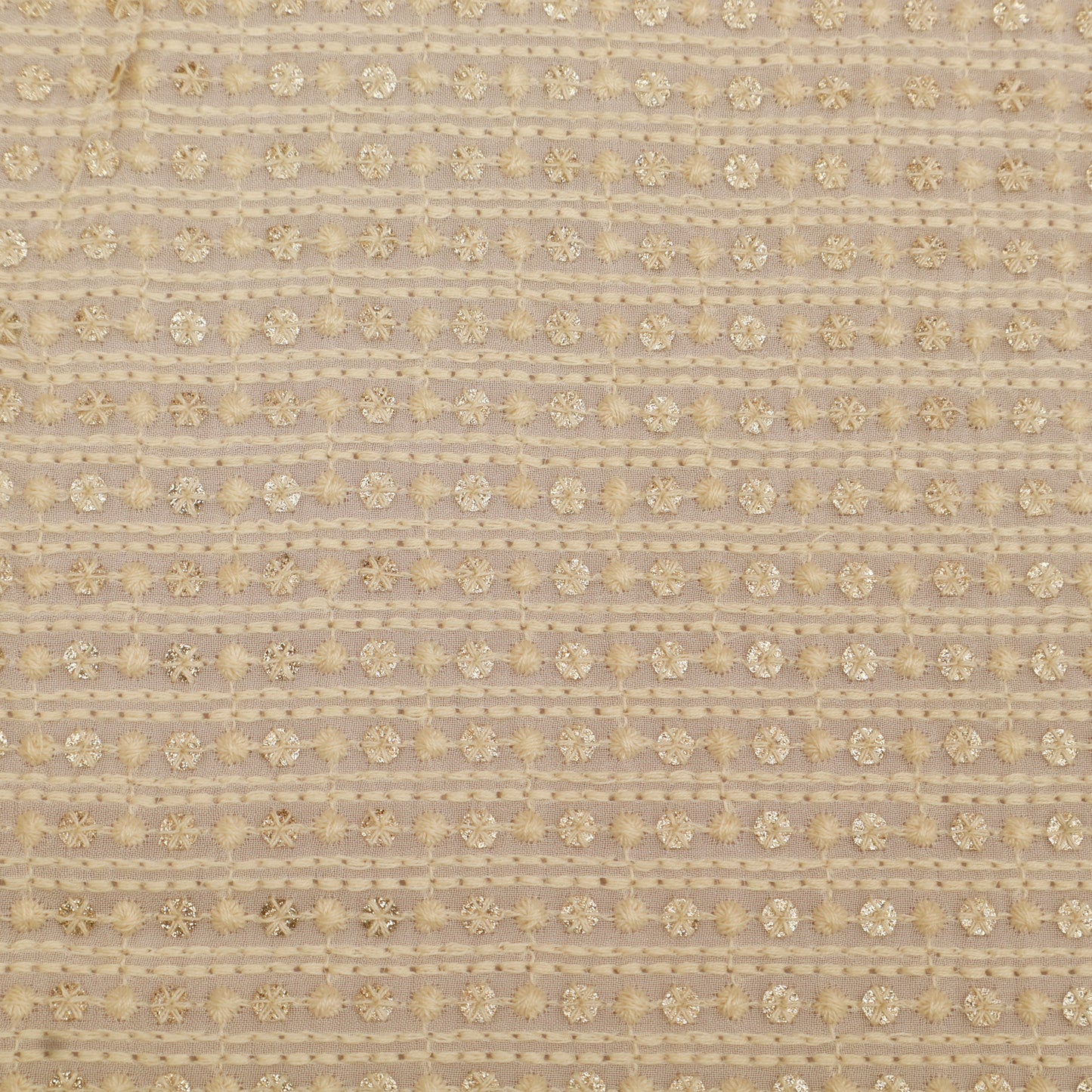 Textured fabric pattern with gold floral design on a beige background