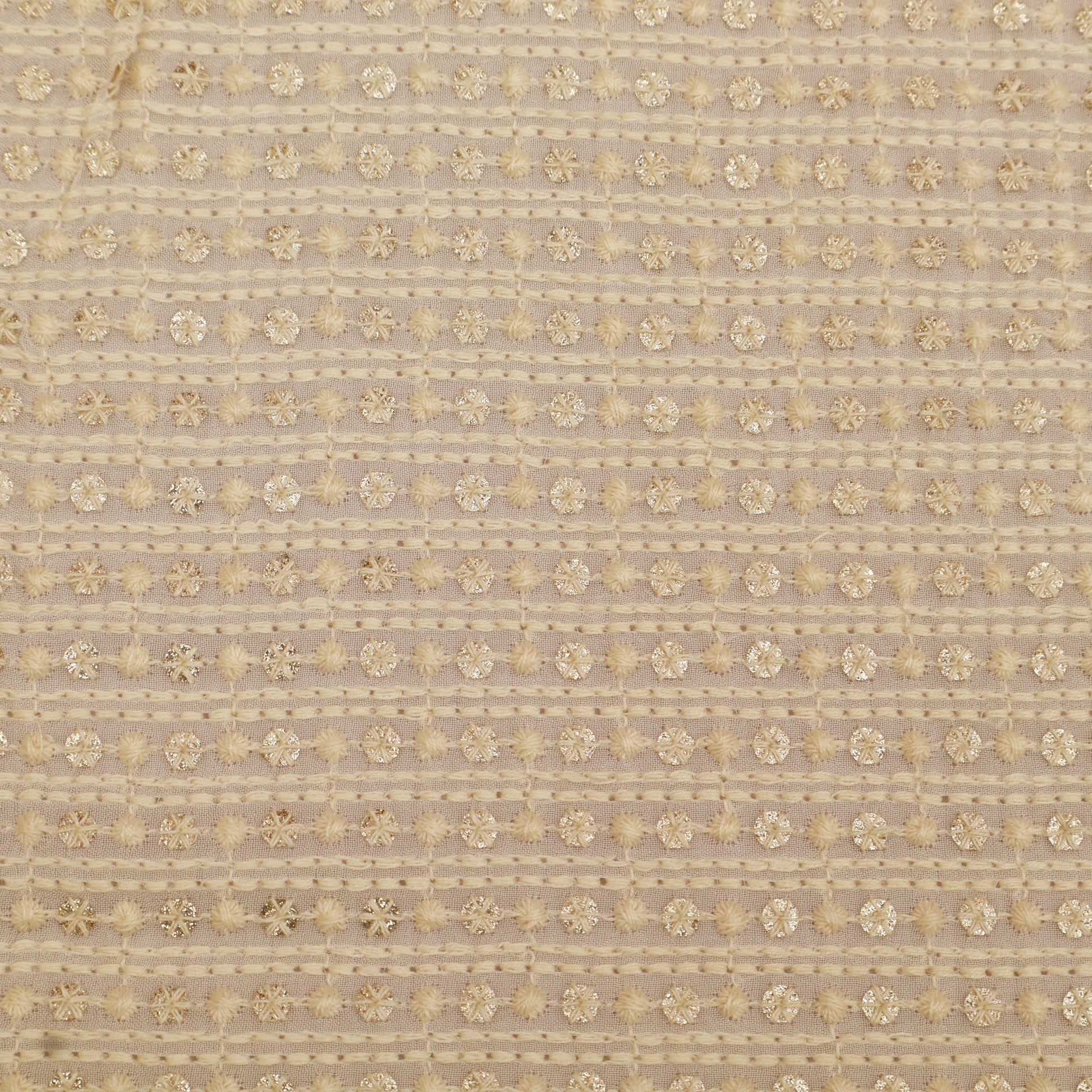 Textured fabric pattern with gold floral design on a beige background