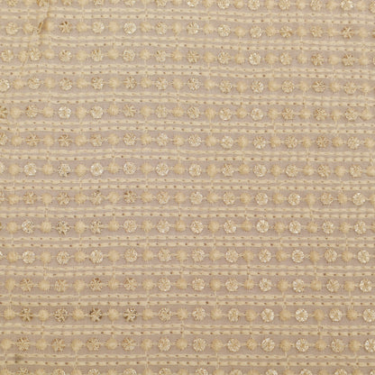 Textured fabric pattern with gold floral design on a beige background