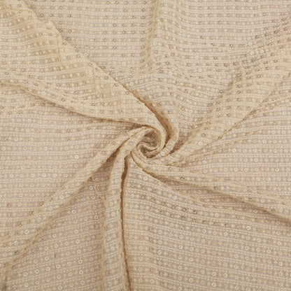 Close-up of beige fabric with a subtle pattern
