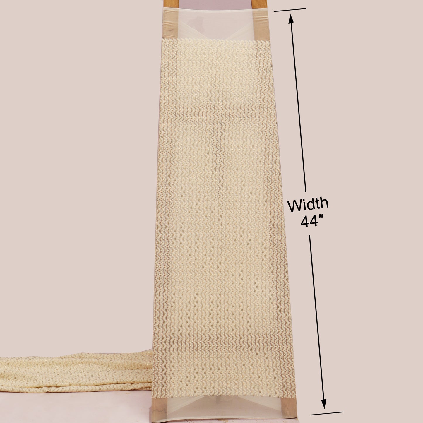 Beige textured rug with a measurement label indicating width 44 inches on a plain background.