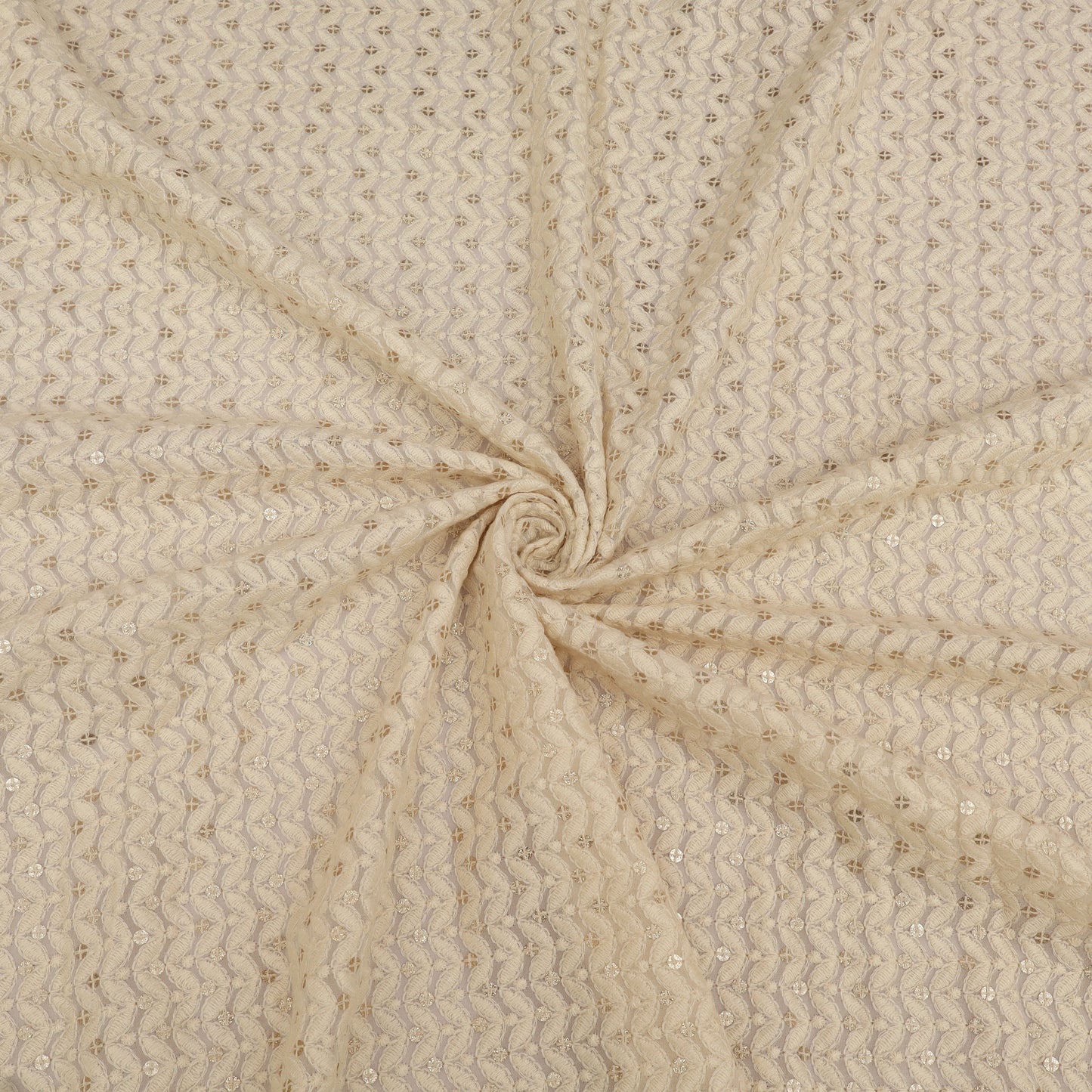 Beige fabric with a subtle pattern, swirled for display