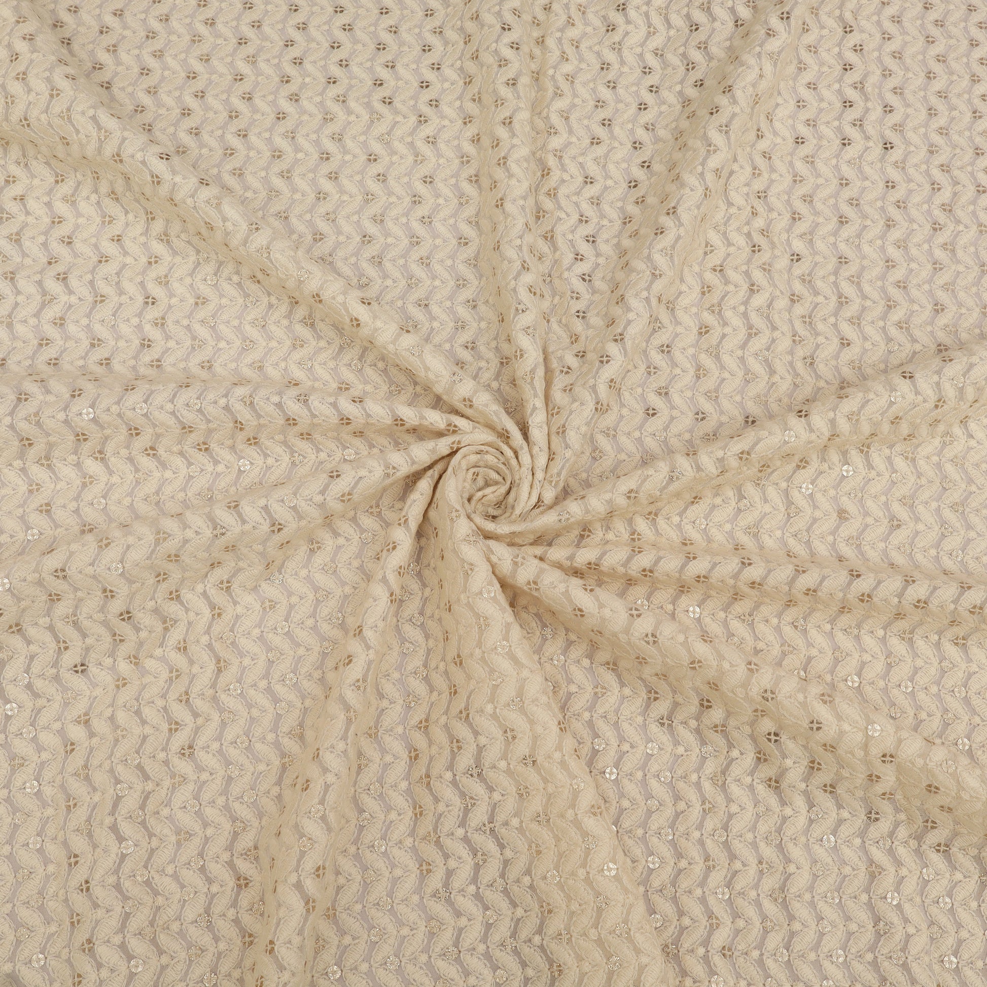 Beige fabric with a subtle pattern, swirled for display