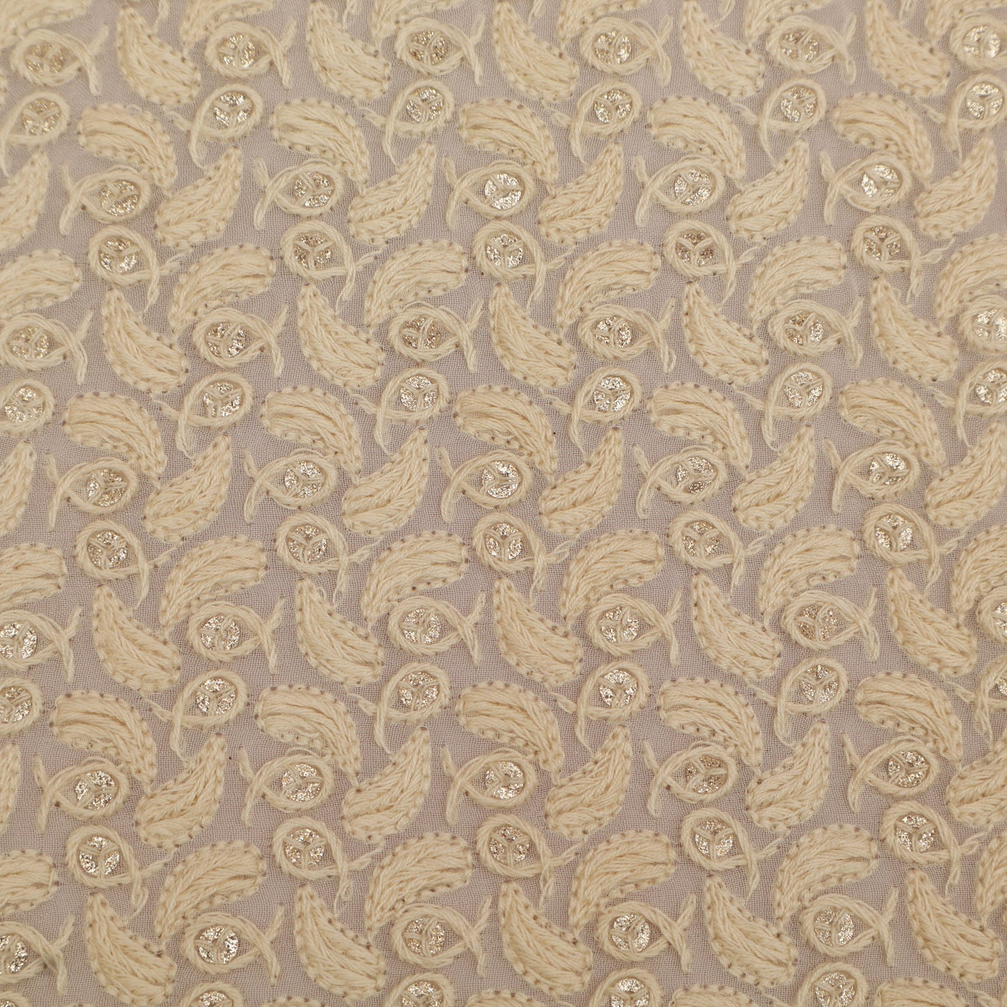 Patterned fabric with beige paisley design on a beige background
