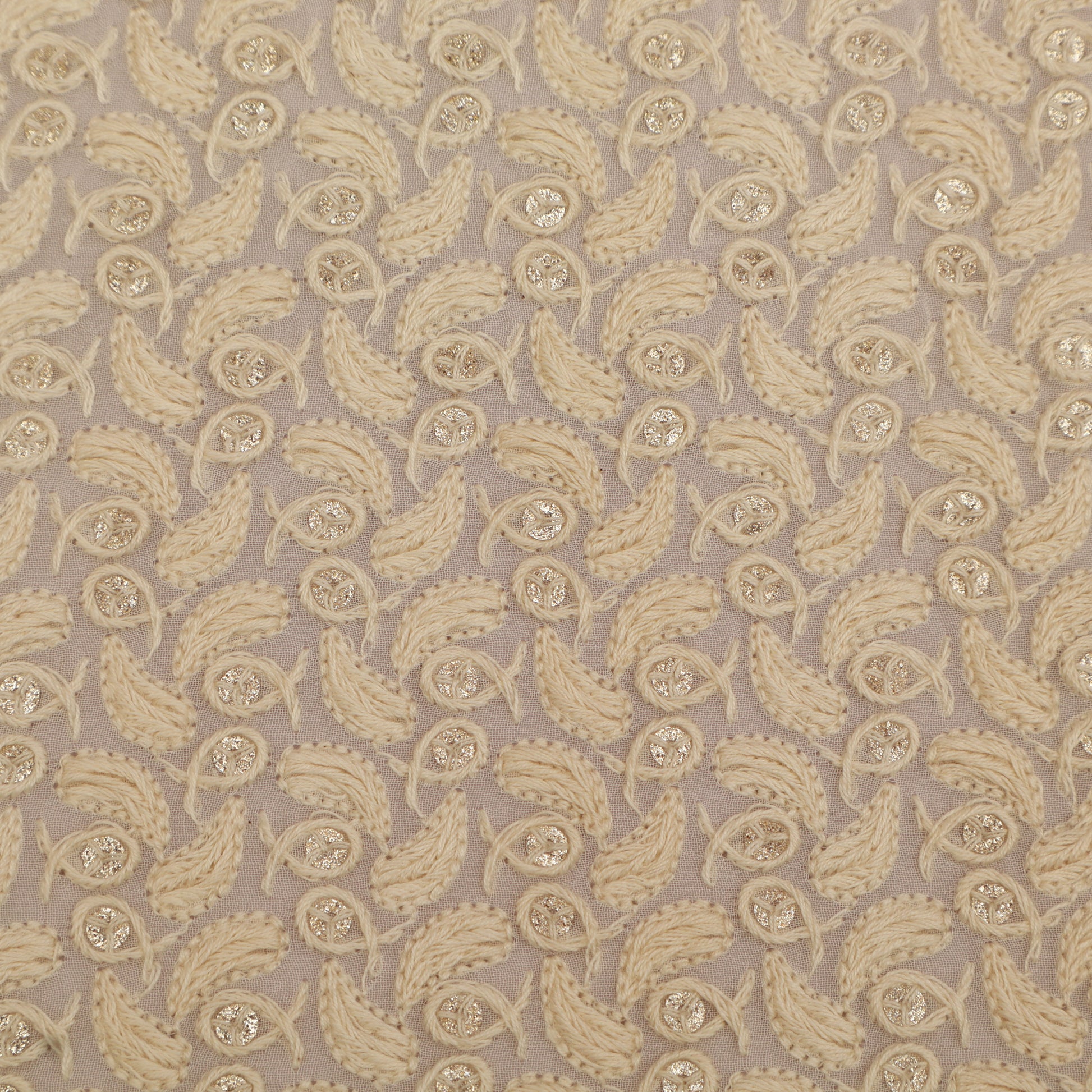 Patterned fabric with beige paisley design on a beige background