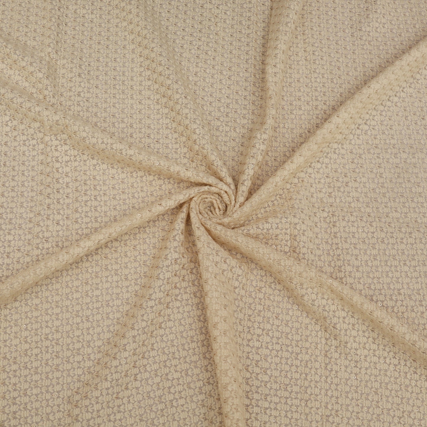 Close-up of beige fabric with a swirling pattern