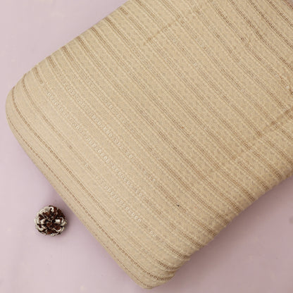 Beige textured pouch with a small pine cone on a light pink background