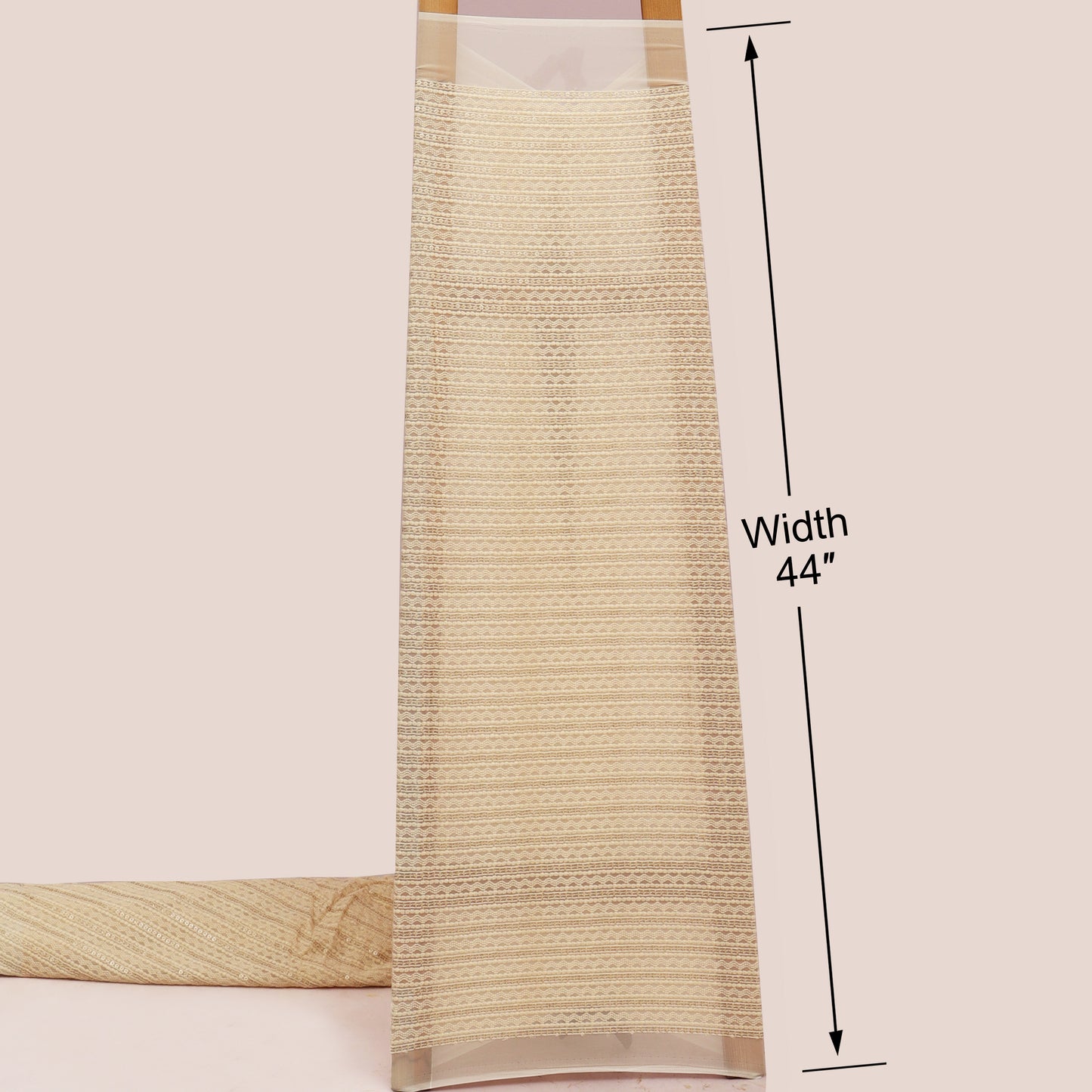 Beige woven blind with a measurement label indicating width 44 inches on a light pink background.