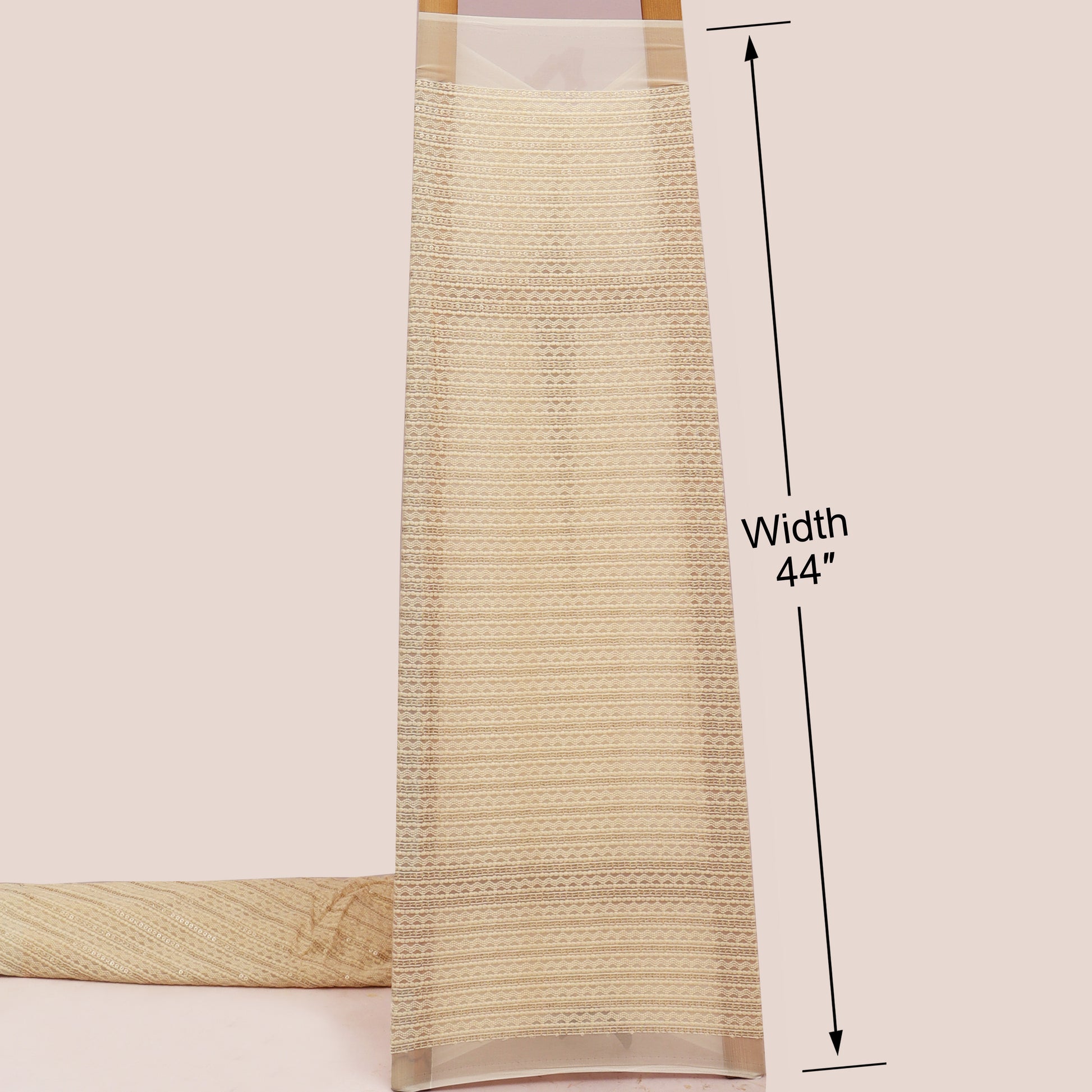 Beige woven blind with a measurement label indicating width 44 inches on a light pink background.