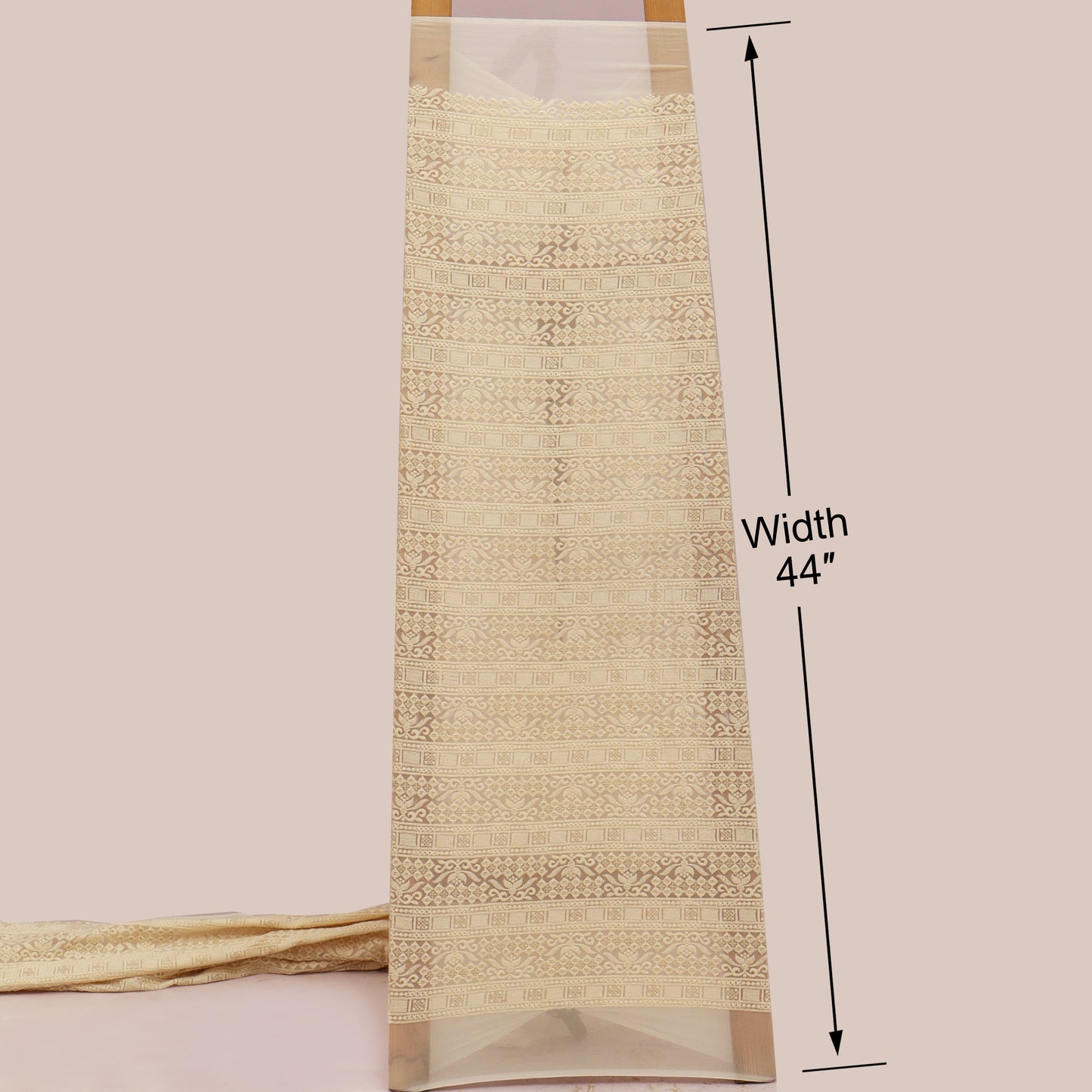 Textured fabric with a width measurement of 44 inches on a plain background