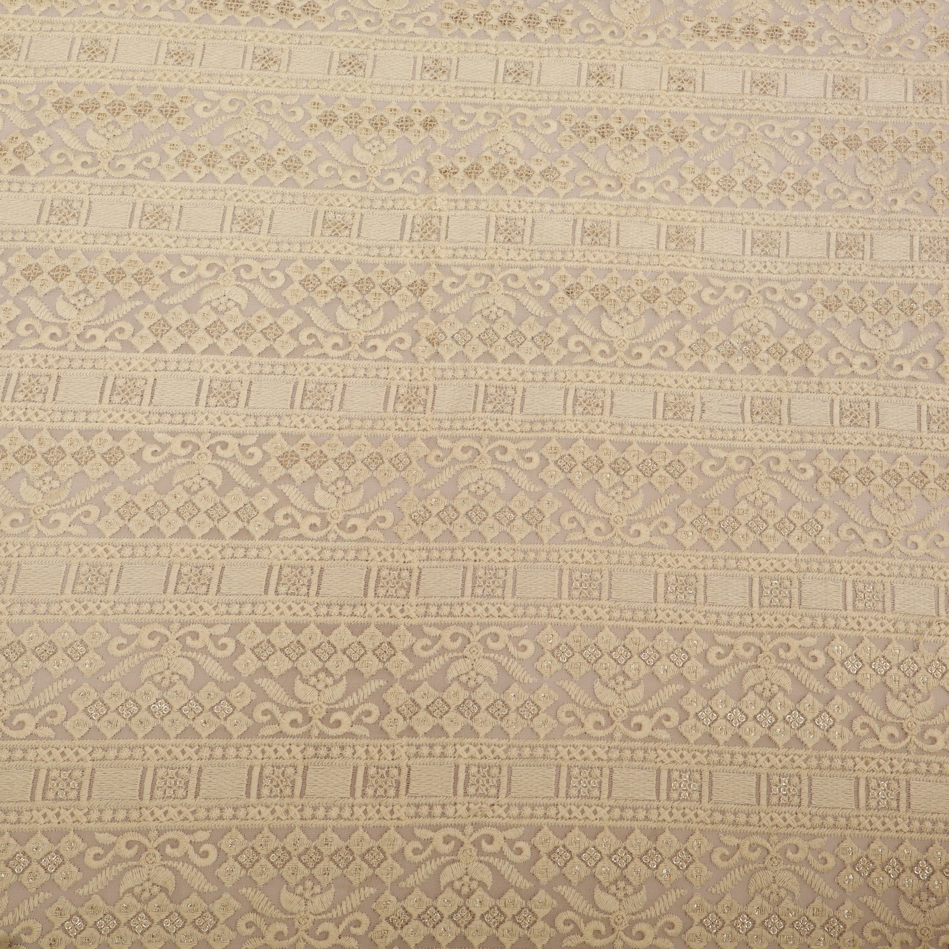 Patterned fabric with geometric design in beige tones