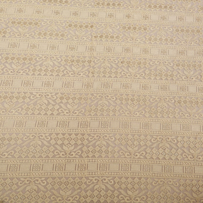 Patterned fabric with geometric design in beige tones