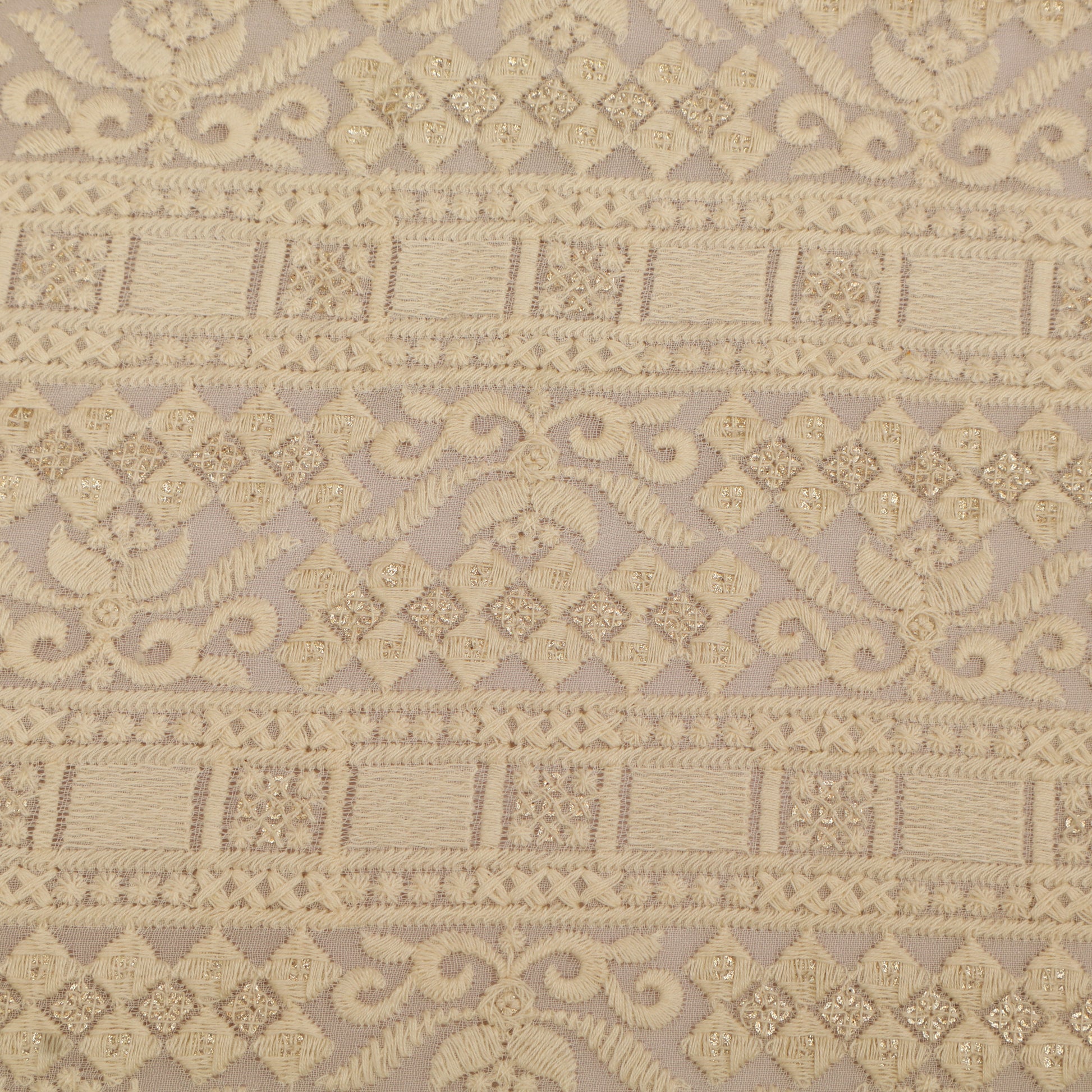 Decorative fabric pattern with intricate designs on a beige background