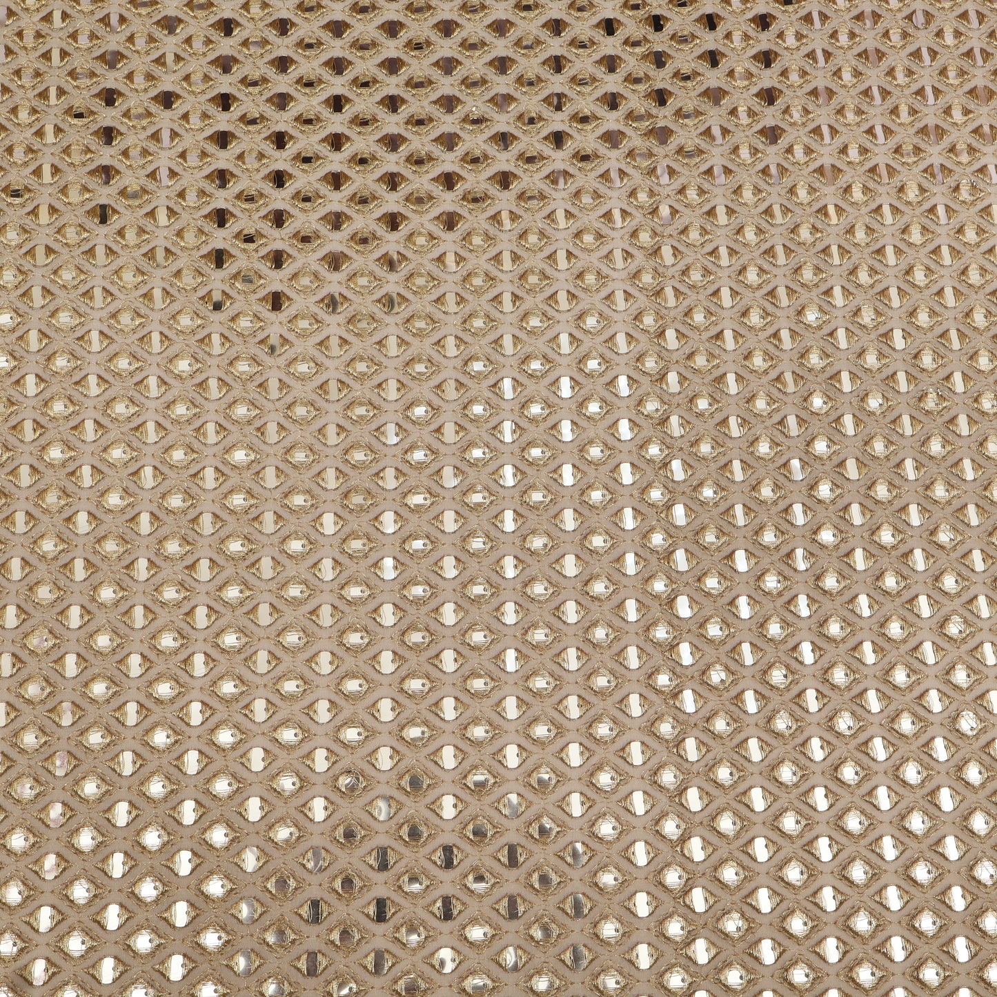 Close-up of a textured beige fabric with a diamond pattern