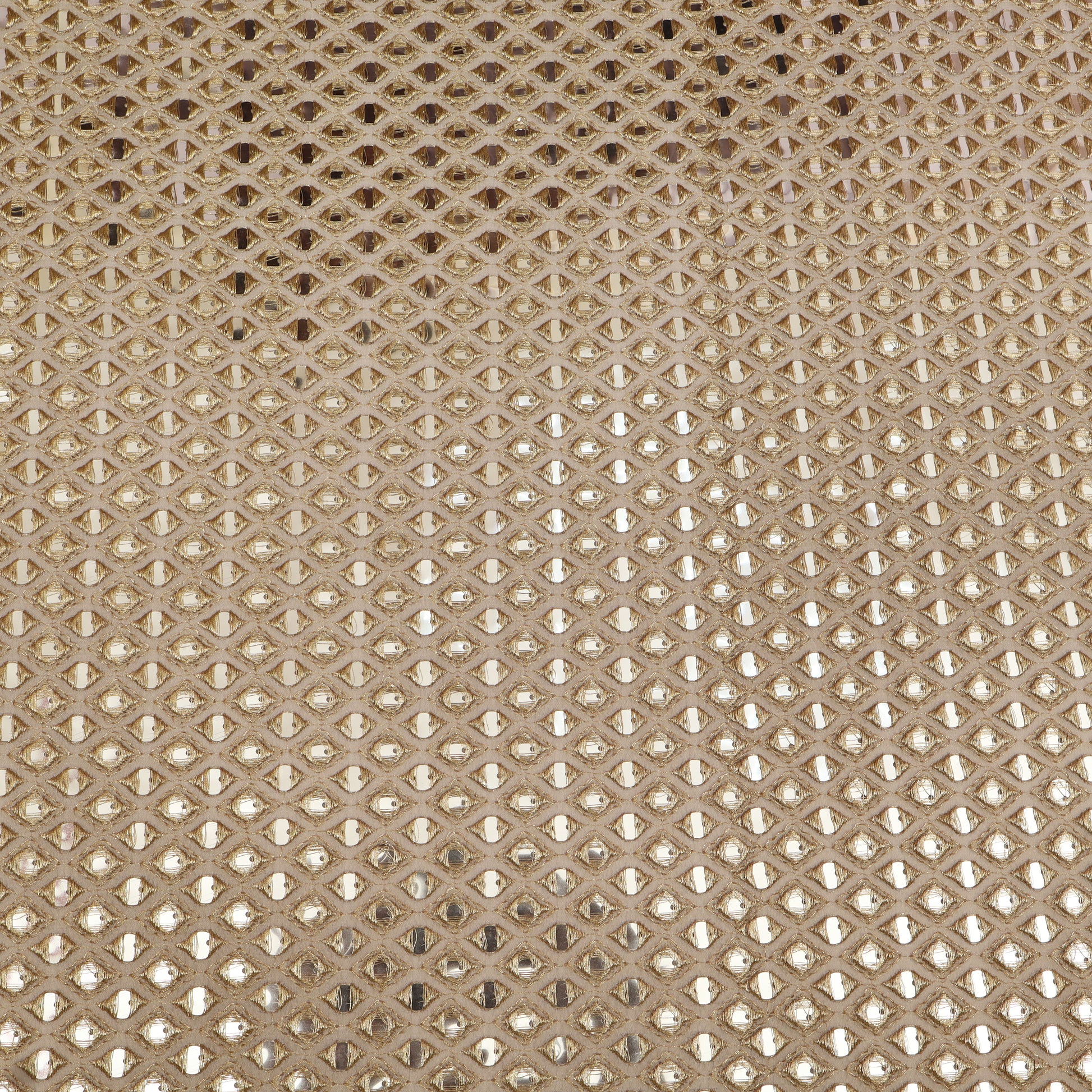 Close-up of a textured beige fabric with a diamond pattern
