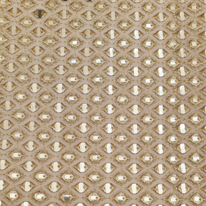 Patterned fabric with a geometric design in beige and gold tones