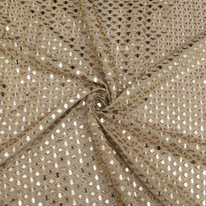 Close-up of beige fabric with a subtle pattern