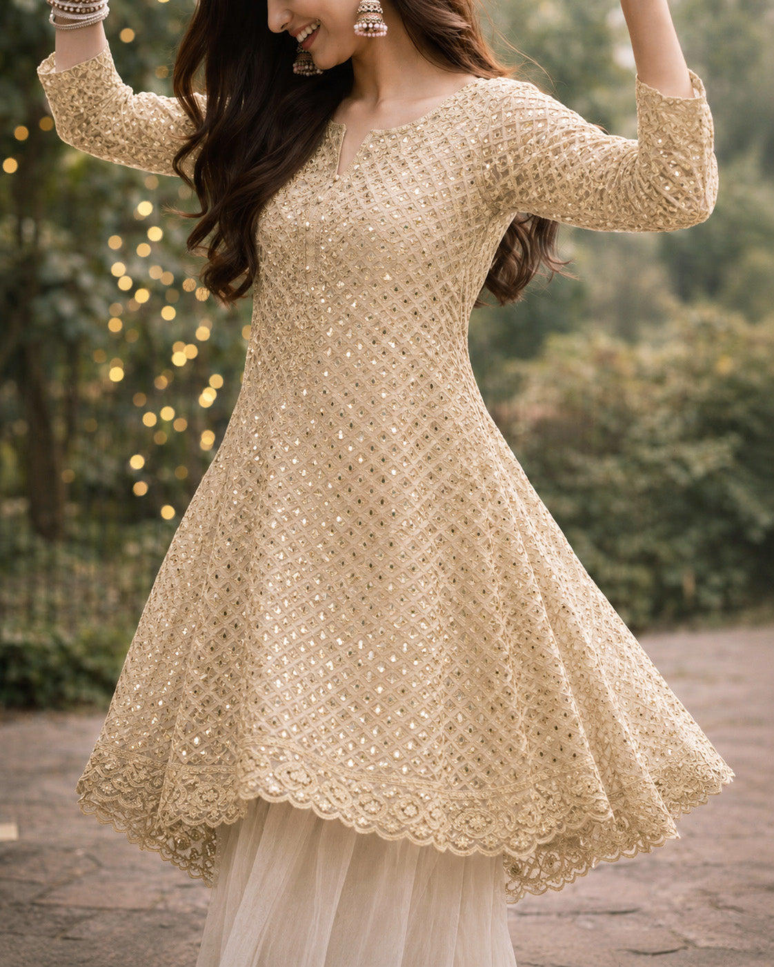 Woman wearing a gold embroidered dress with a blurred background