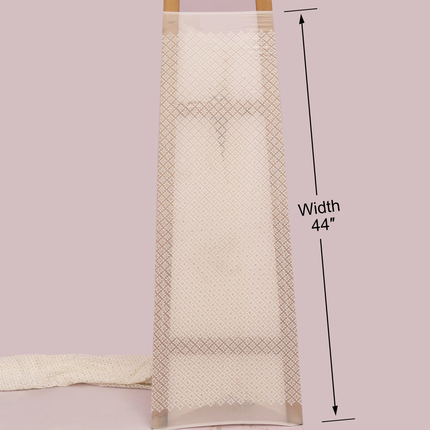 Beige towel with measurement label on a White background