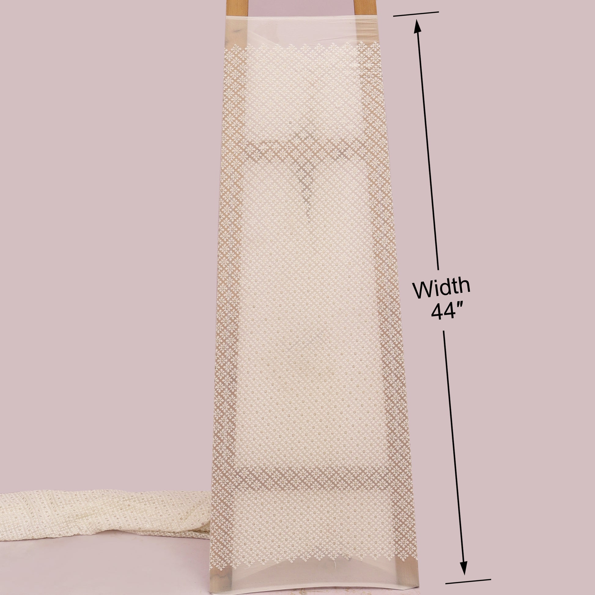 Beige towel with measurement label on a White background