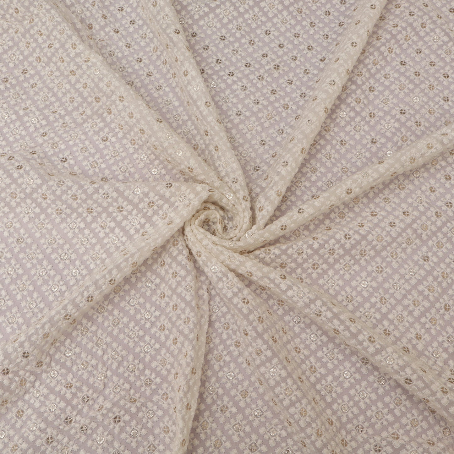 Close-up of beige fabric with subtle pattern on a White background