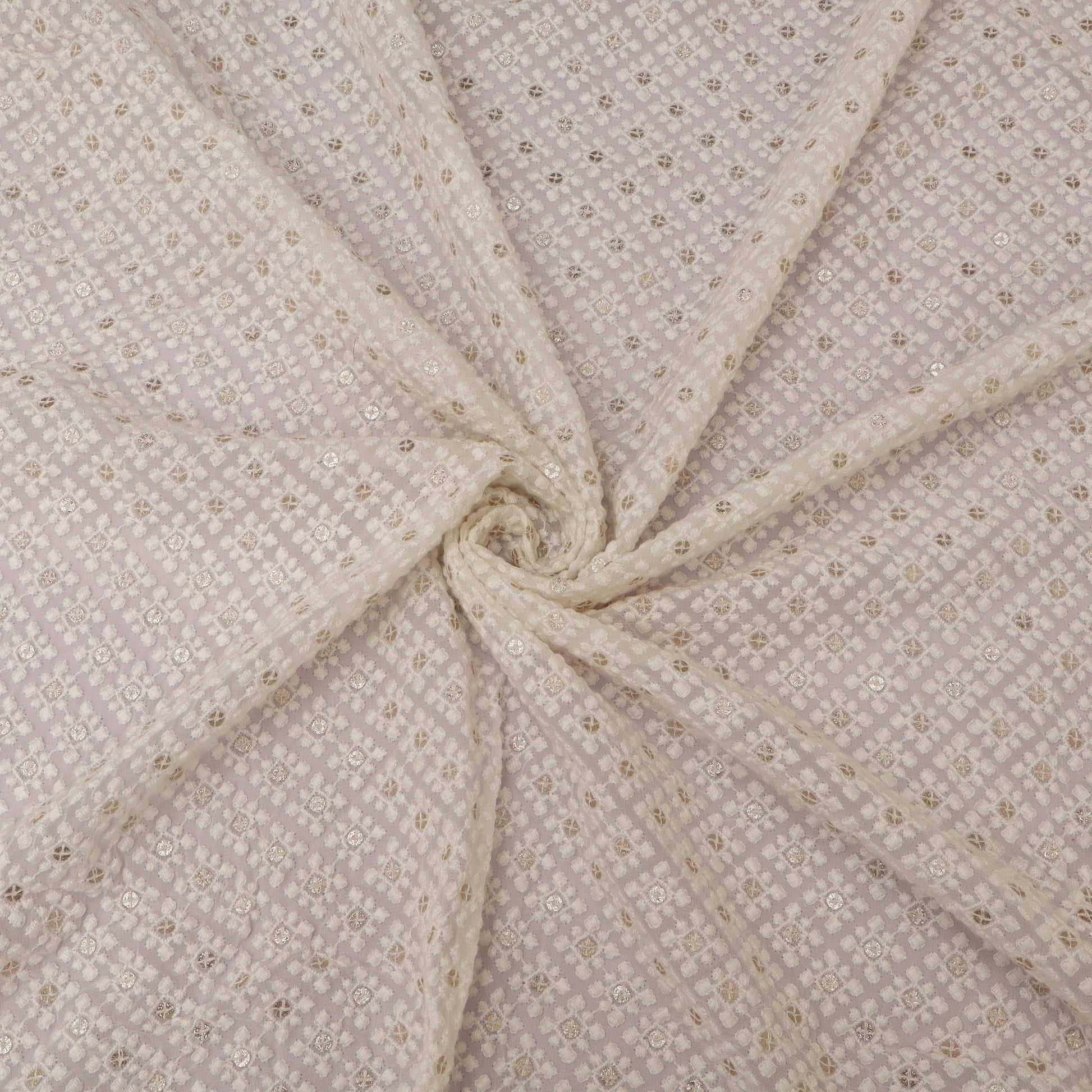 Close-up of beige fabric with subtle pattern on a White background