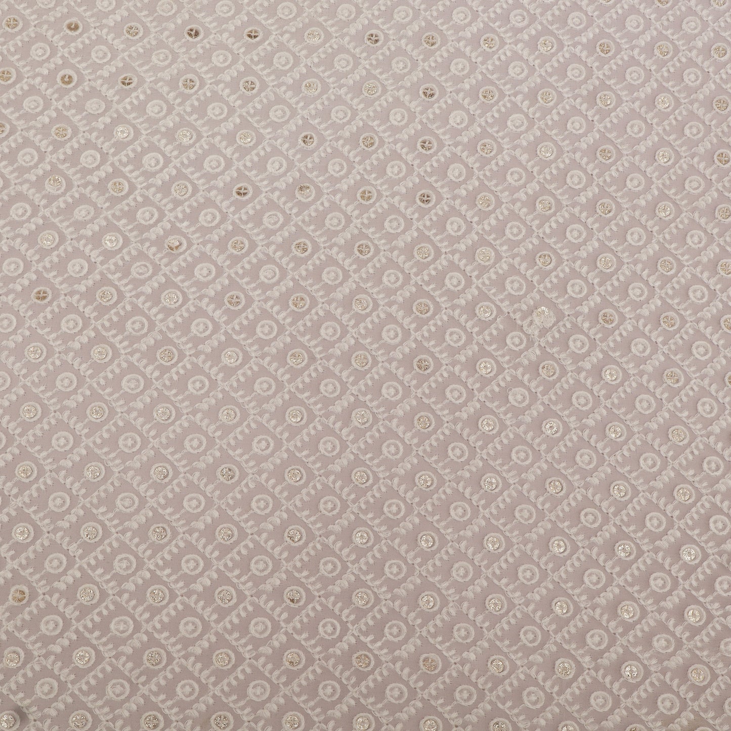 Patterned fabric swatch with small floral design on a gray background