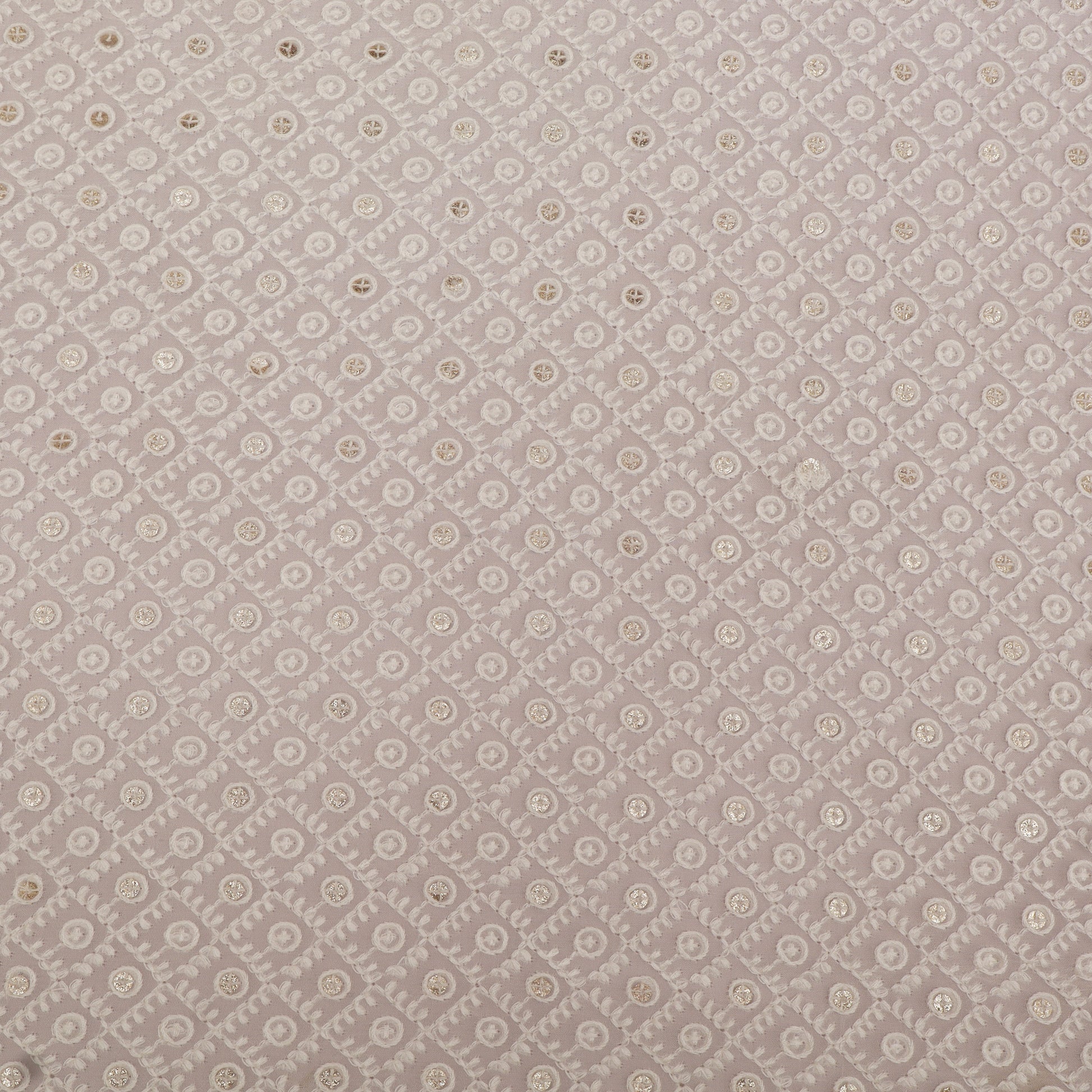 Patterned fabric swatch with small floral design on a gray background