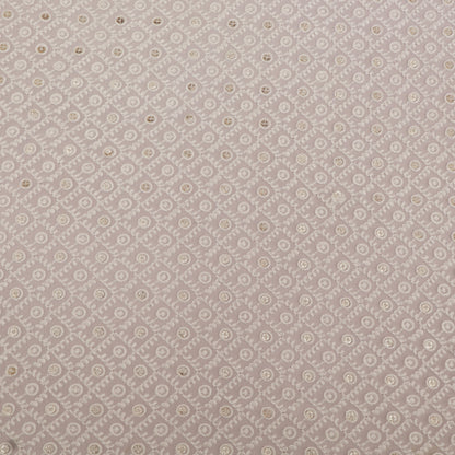 Patterned fabric swatch with small floral design on a gray background