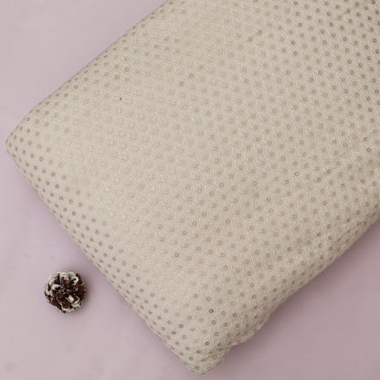 Textured beige pillow on a pink background with a pine cone