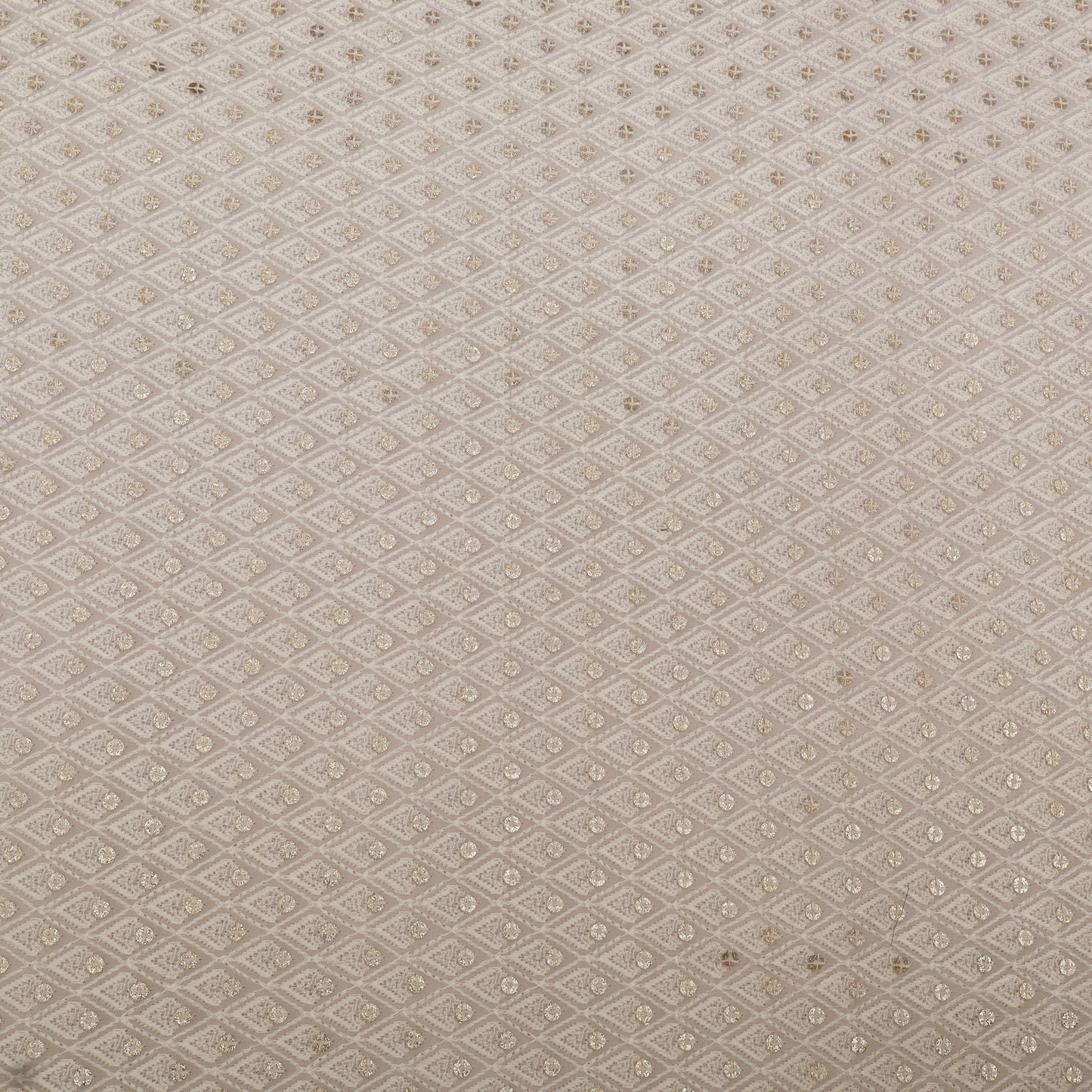 Textured fabric pattern with a subtle geometric design on a beige background