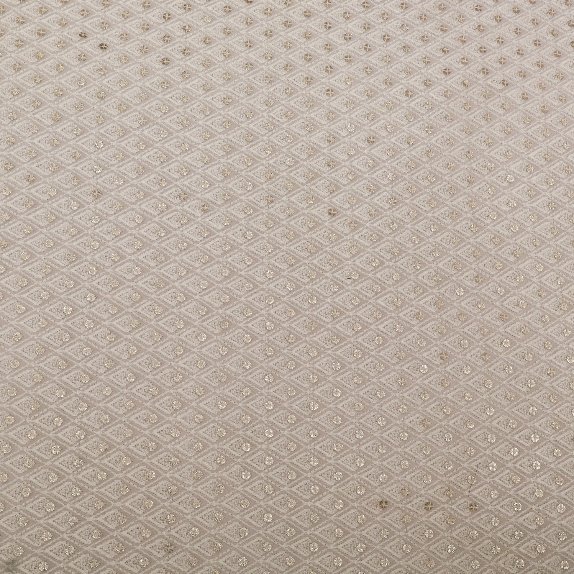 Textured fabric pattern with a subtle geometric design on a beige background
