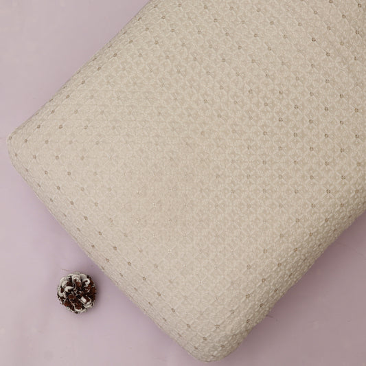 Textured White pillow on a White background with a pine cone.