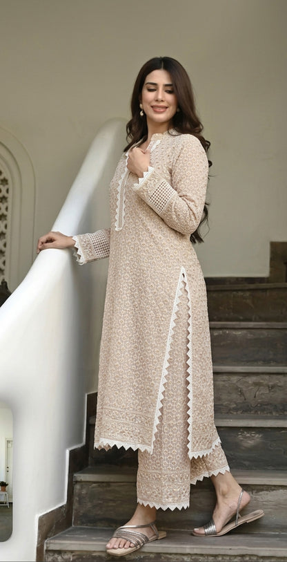 Woman in a White long dress standing on a staircase