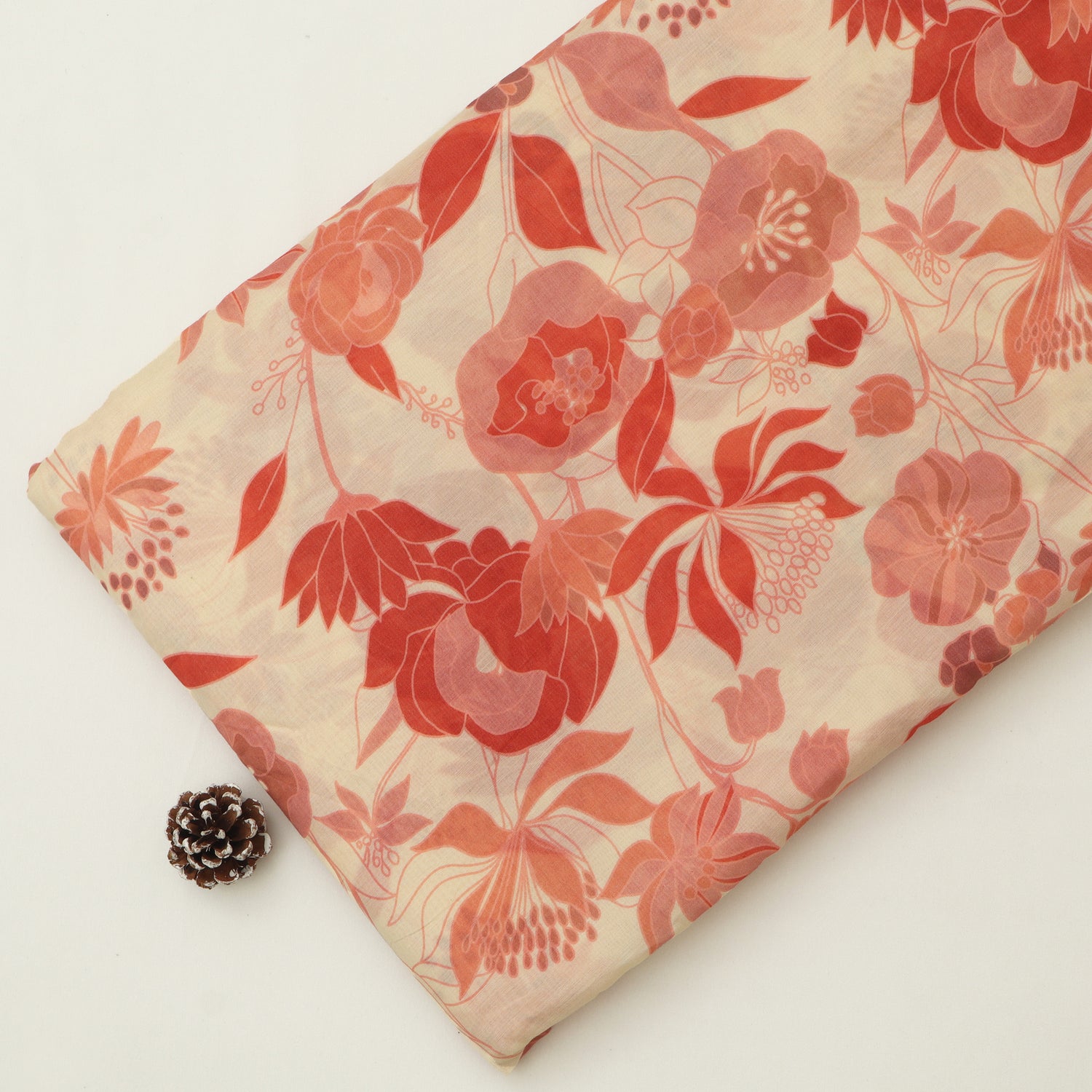 Floral fabric with red flowers on a beige background