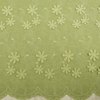 Green fabric with floral lace pattern