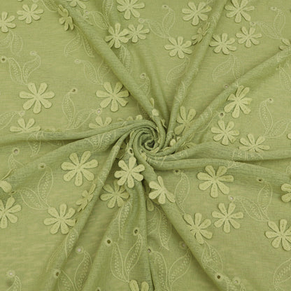 Green fabric with floral embroidery pattern