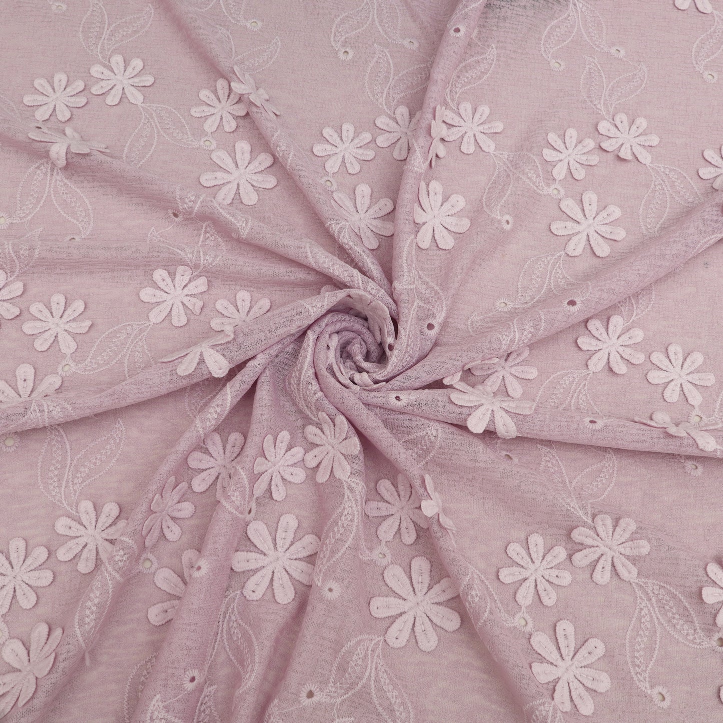 Pink fabric with white floral embroidery
