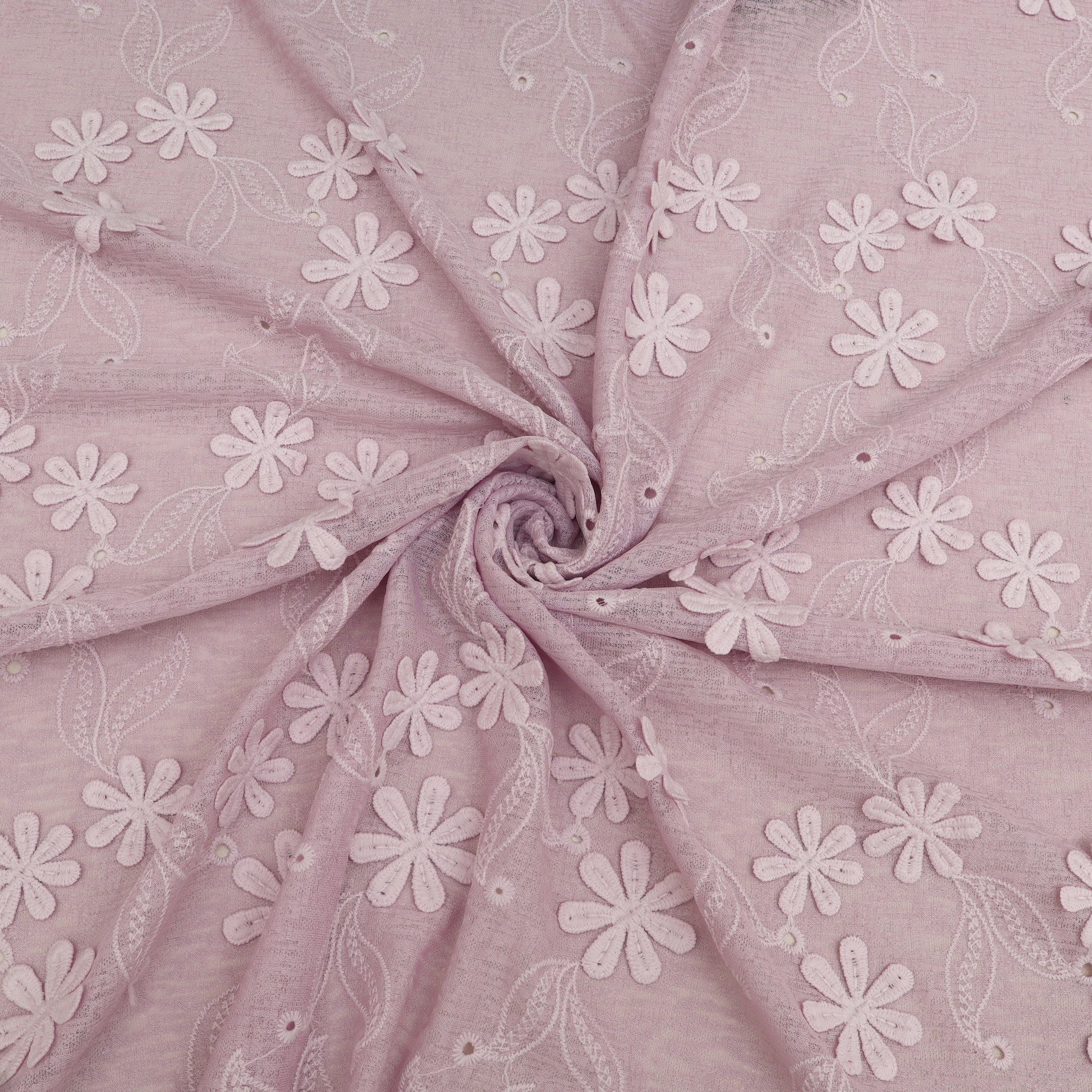 Pink fabric with white floral embroidery