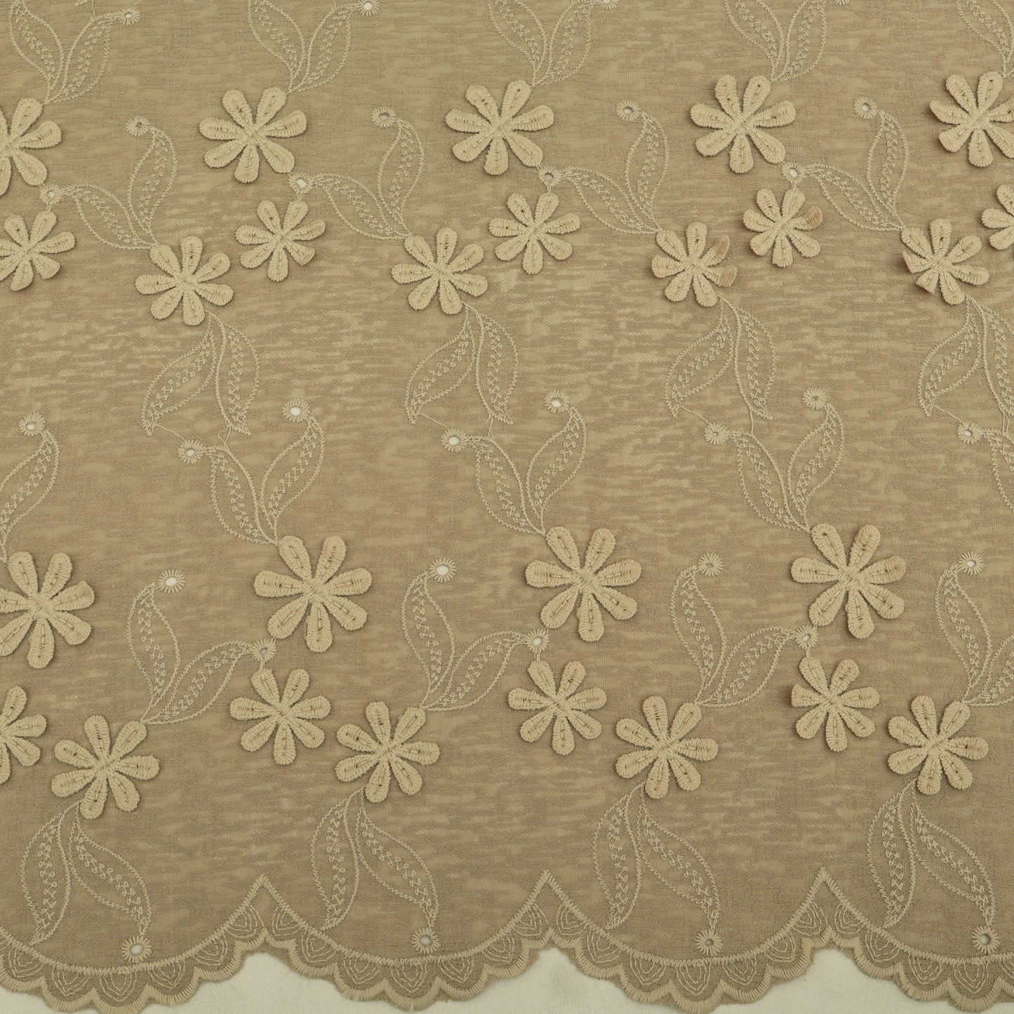 Beige floral lace fabric pattern on a beige background