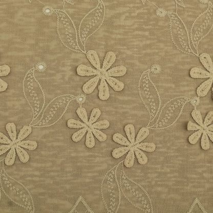 Beige floral embroidery pattern on a textured beige fabric background