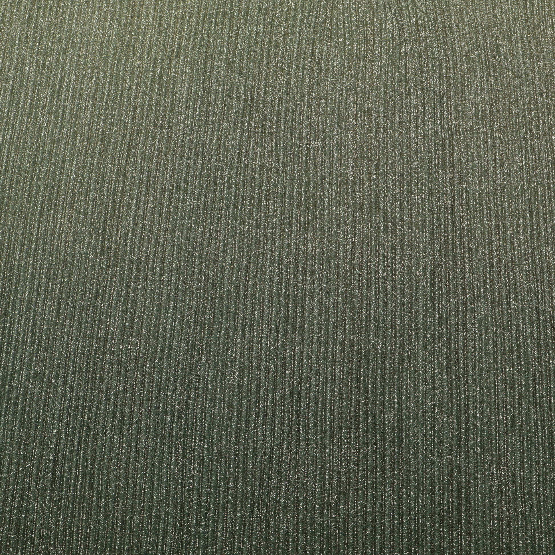 Close-up of a textured green fabric surface