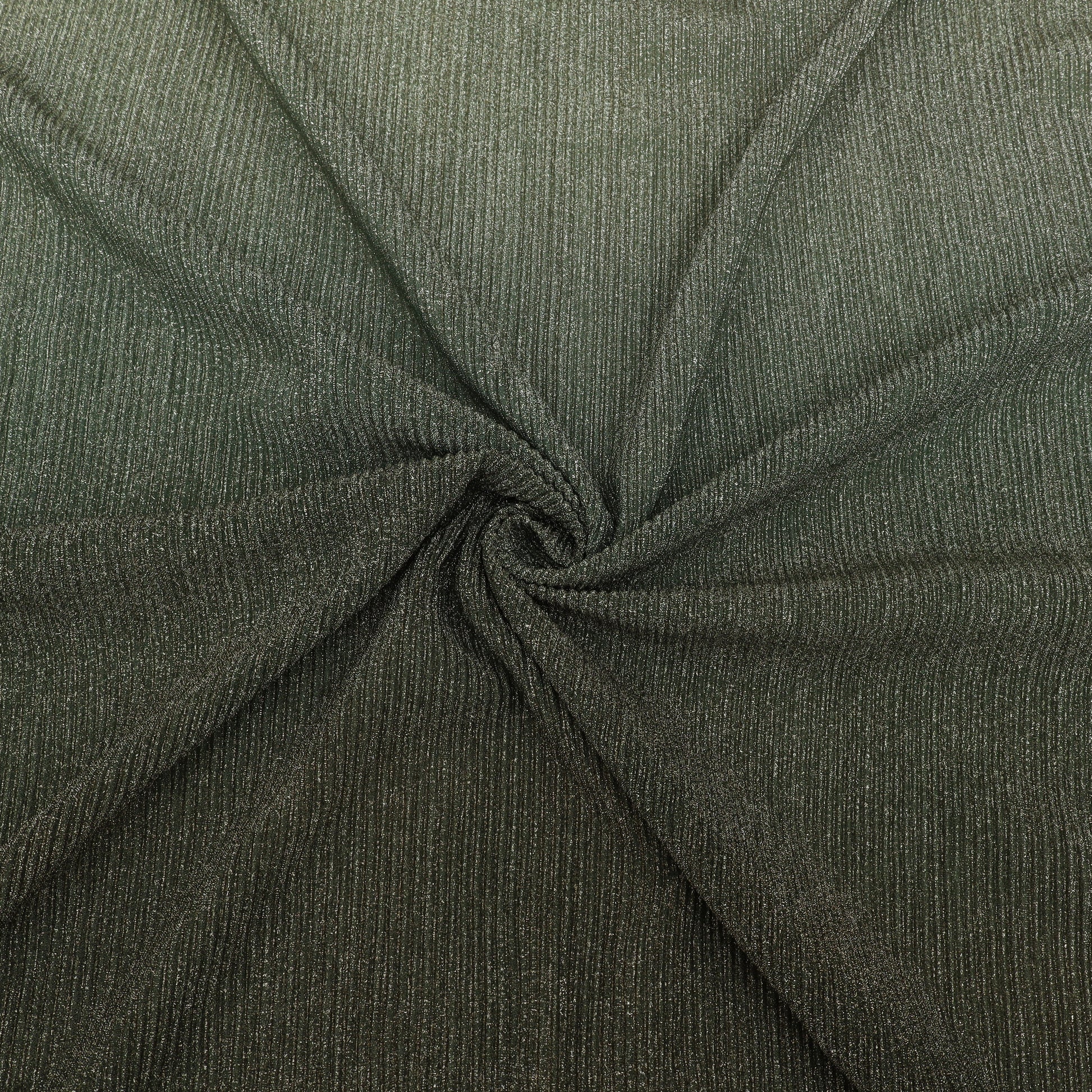 Close-up of dark green fabric with a textured pattern