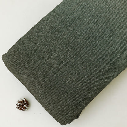 Green fabric roll on a white background