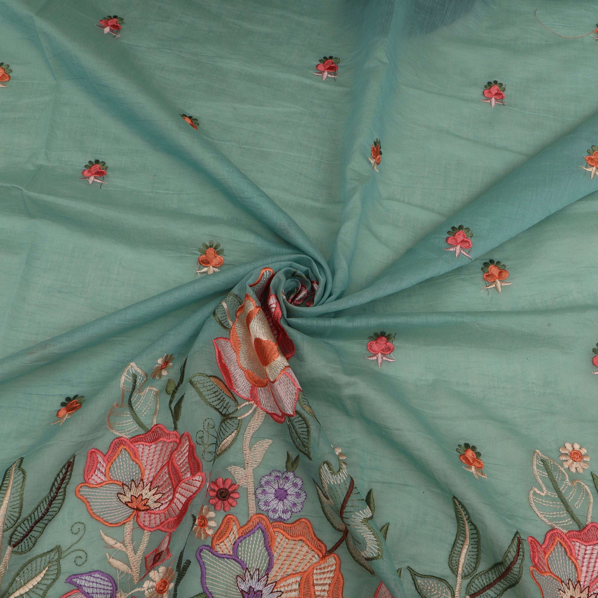 Teal fabric with floral embroidery