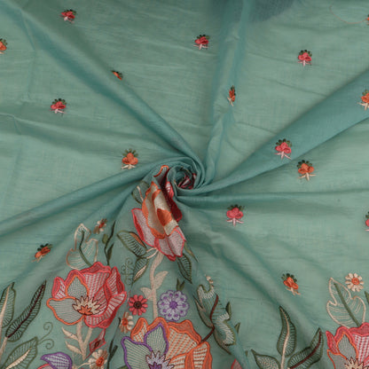Teal fabric with floral embroidery
