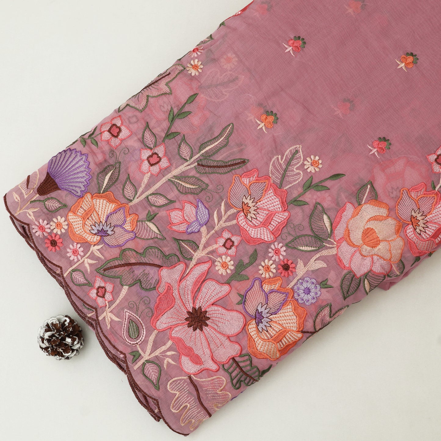 Embroidered fabric with floral patterns on a white background