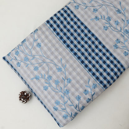 Two fabric swatches with floral and checkered patterns on a white background